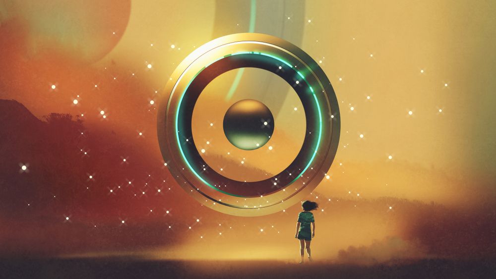 Girl standing before a huge glowing ring device with a floating core, hovering over an amber landscape.
