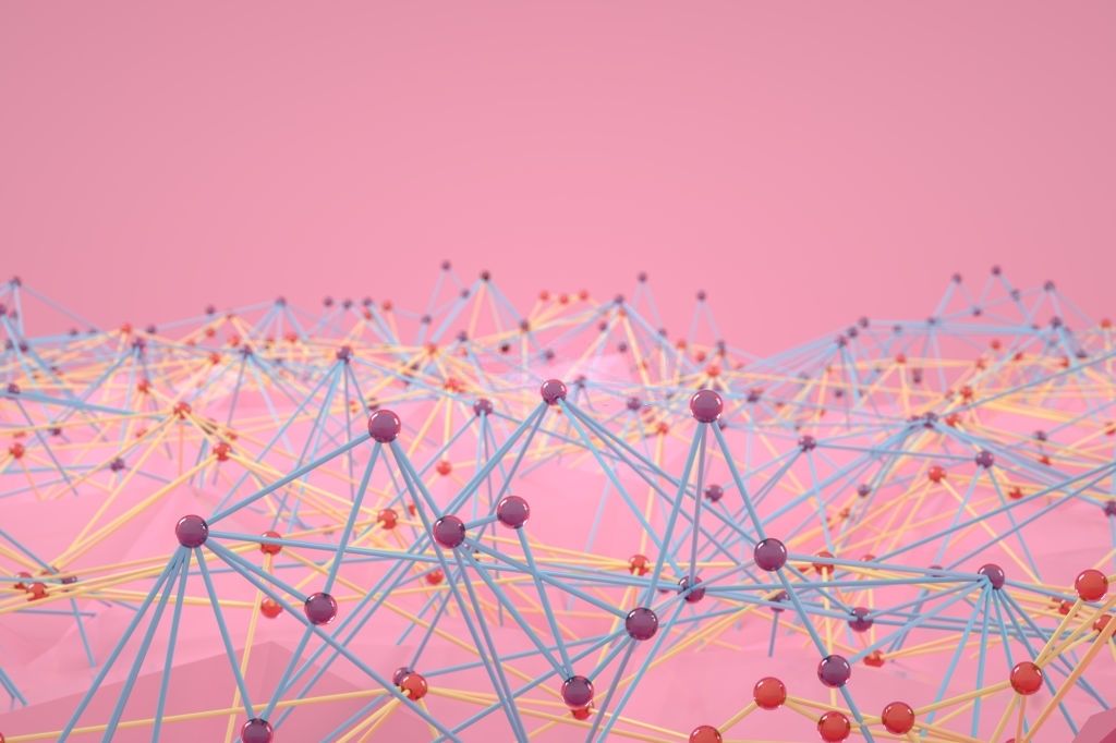 A dense field of small spheres joined by blue and yellow rods, each linked to several others.